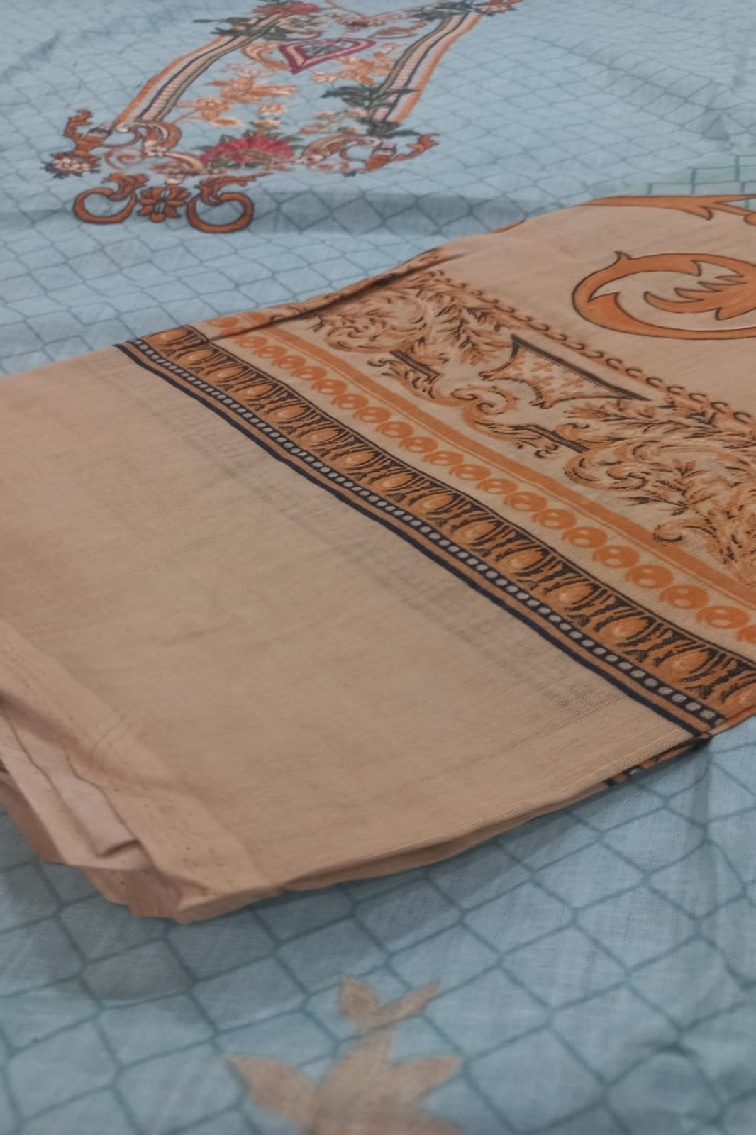 Firdous light blue unstitched suit fabric layout displaying top, bottom and dupatta pieces