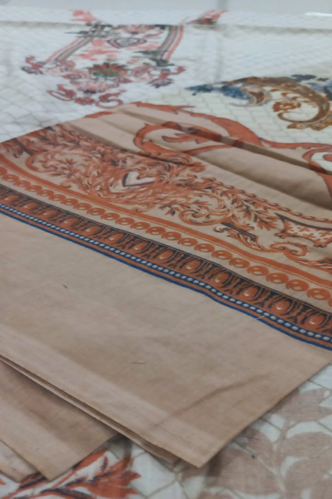 Decorative fabric with intricate patterns on a marble surface
