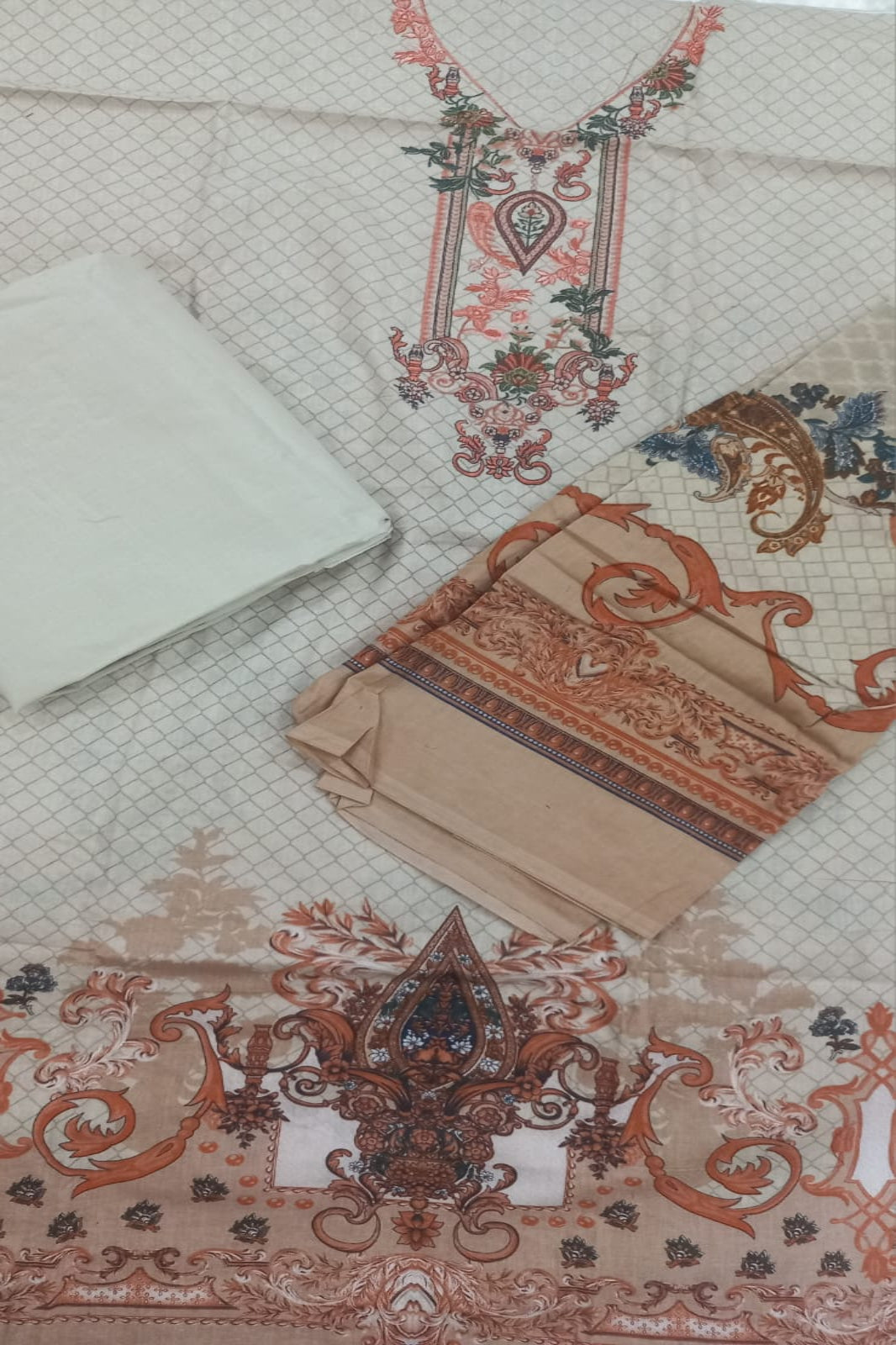 Decorative fabric with intricate patterns and designs on a textured background