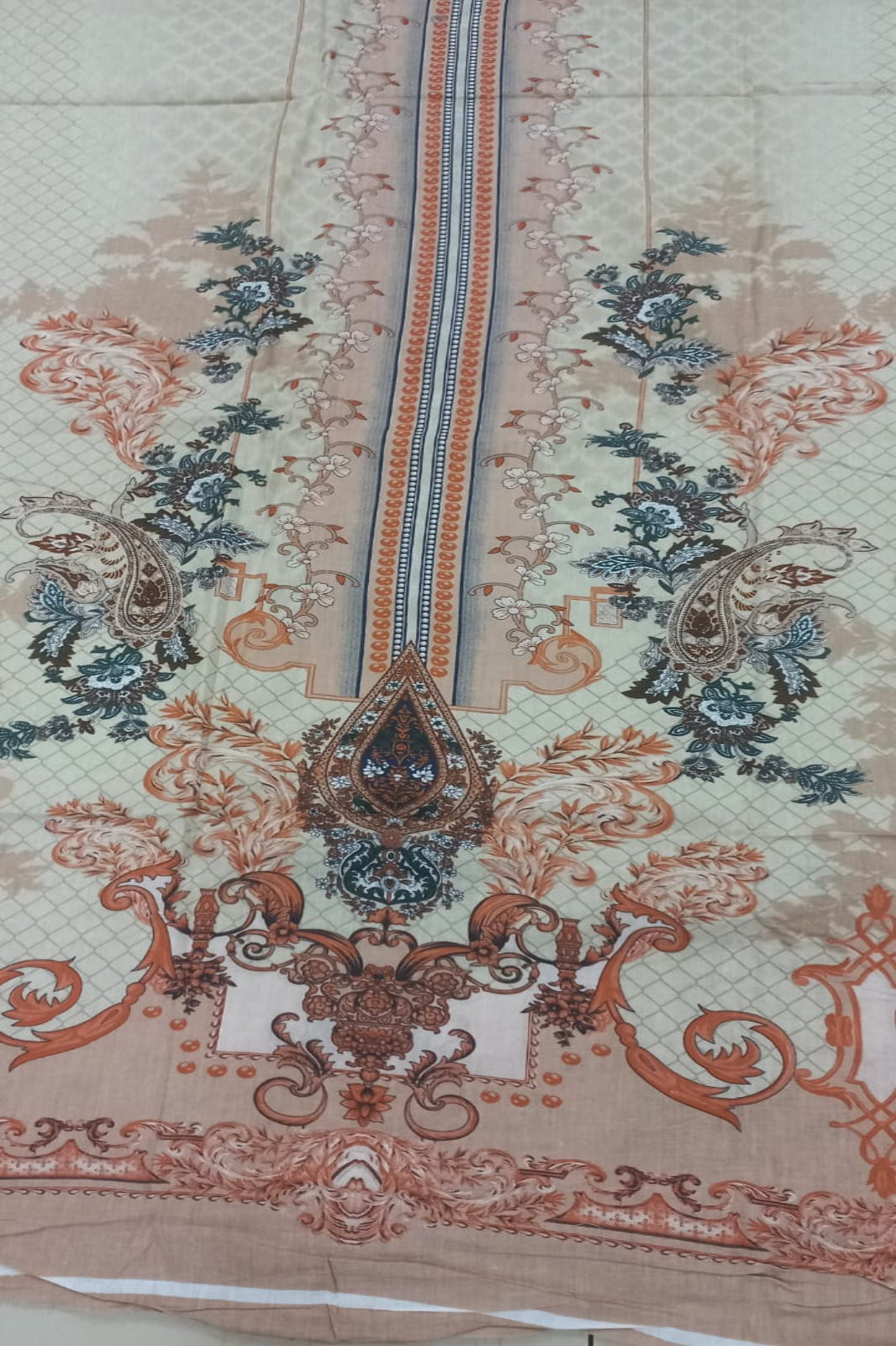 Decorative fabric with intricate patterns and colors on a plain background