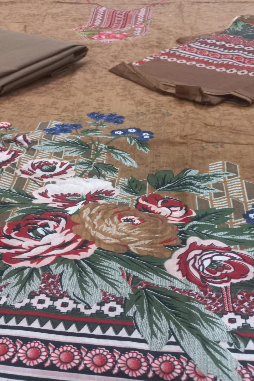 Floral and geometric patterned fabric on a textured surface