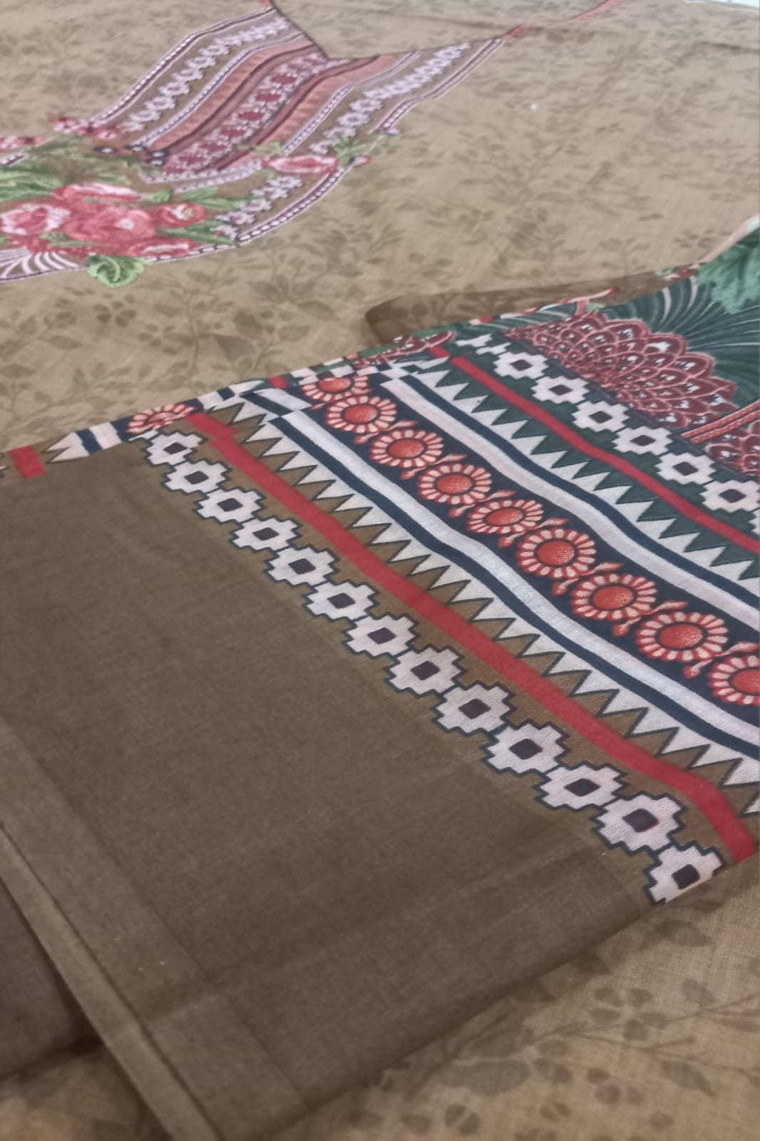 Textile with intricate patterns on a beige background