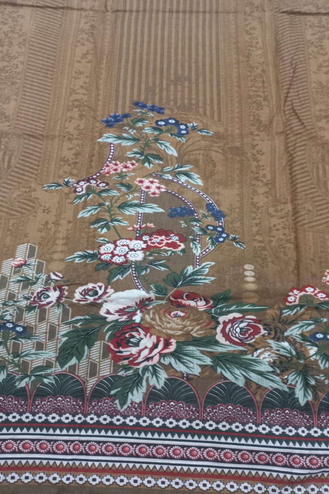 Decorative fabric with floral patterns on a brown background