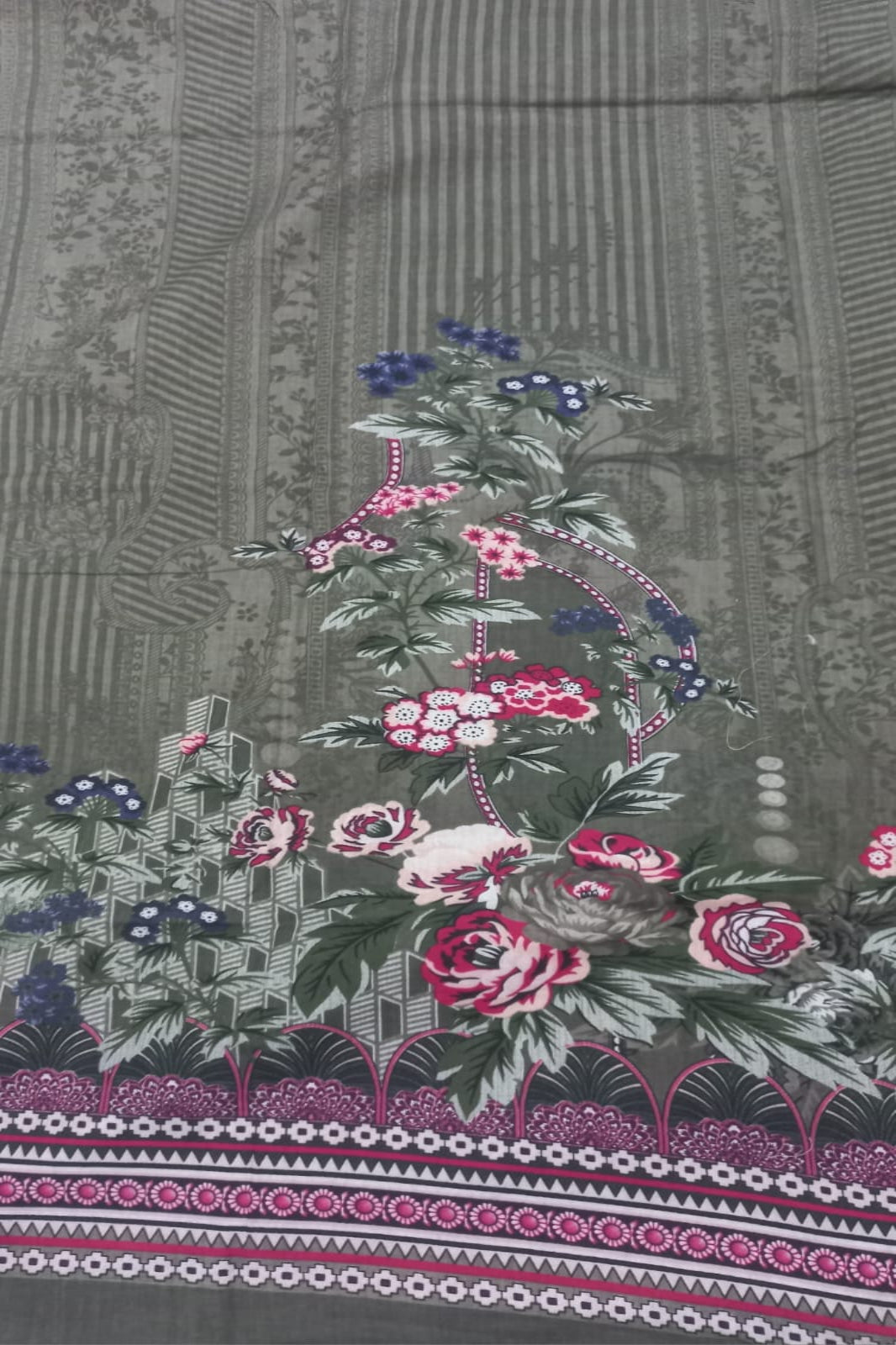 Floral patterned fabric with pink and white flowers on a dark background