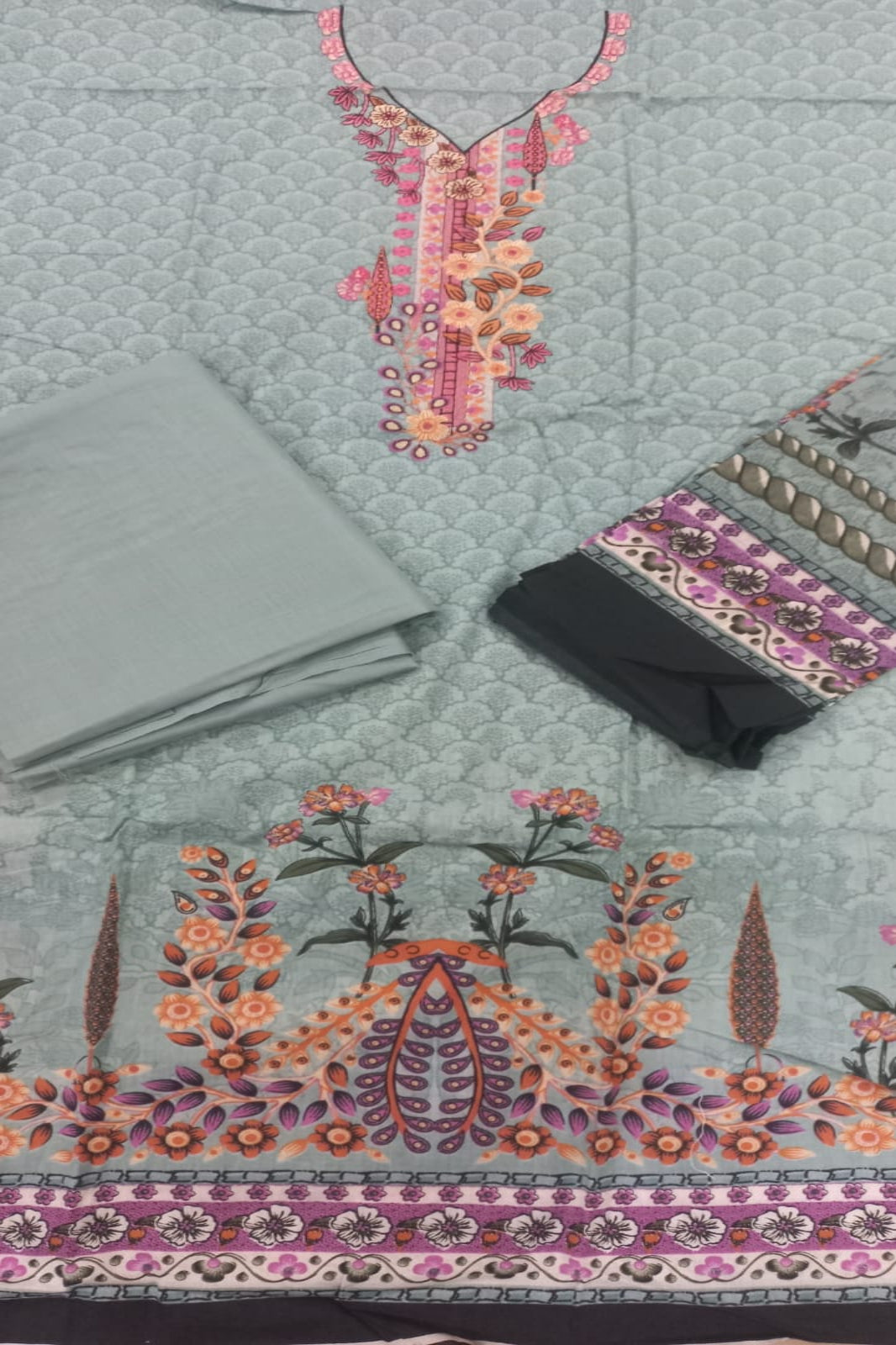 Embroidered fabric with floral patterns on a textured surface