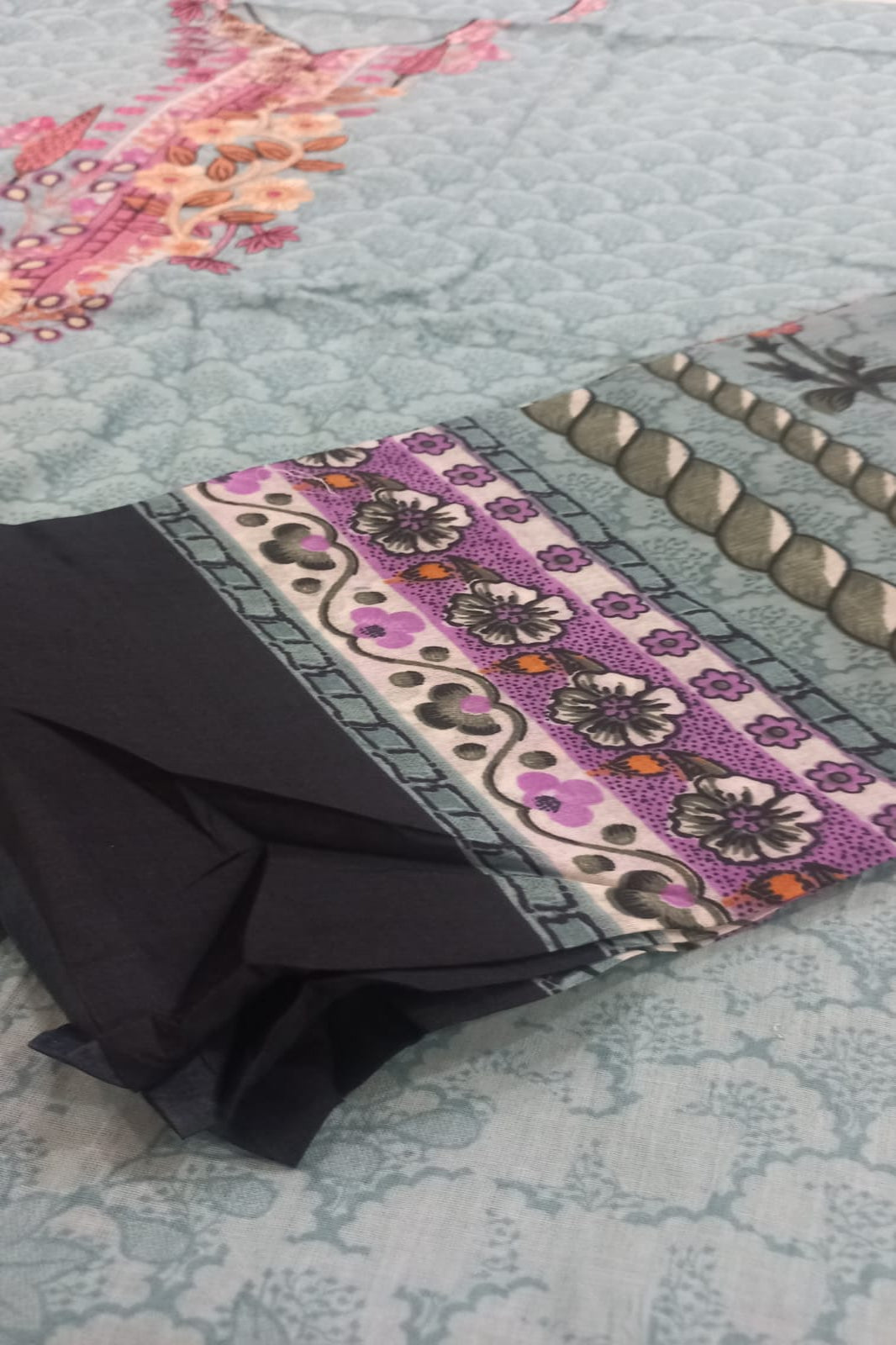 Decorative mat with floral pattern on a textured surface