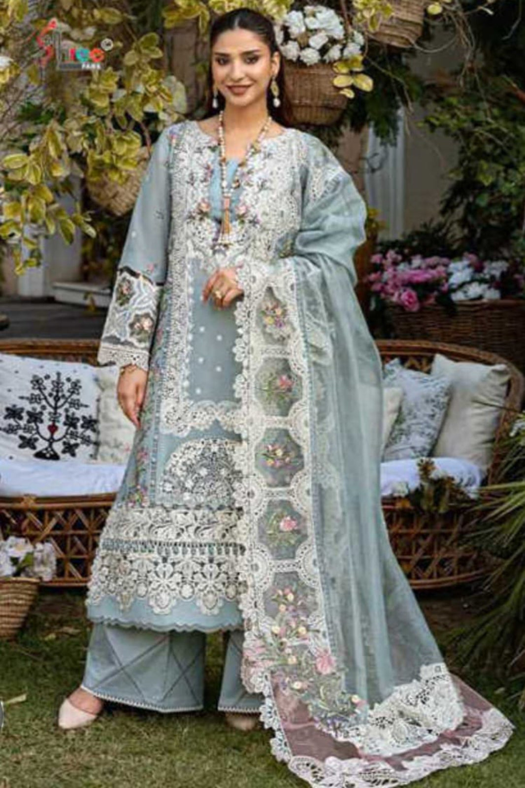 Ombre premium ice blue embroidered traditional outfit with a floral background