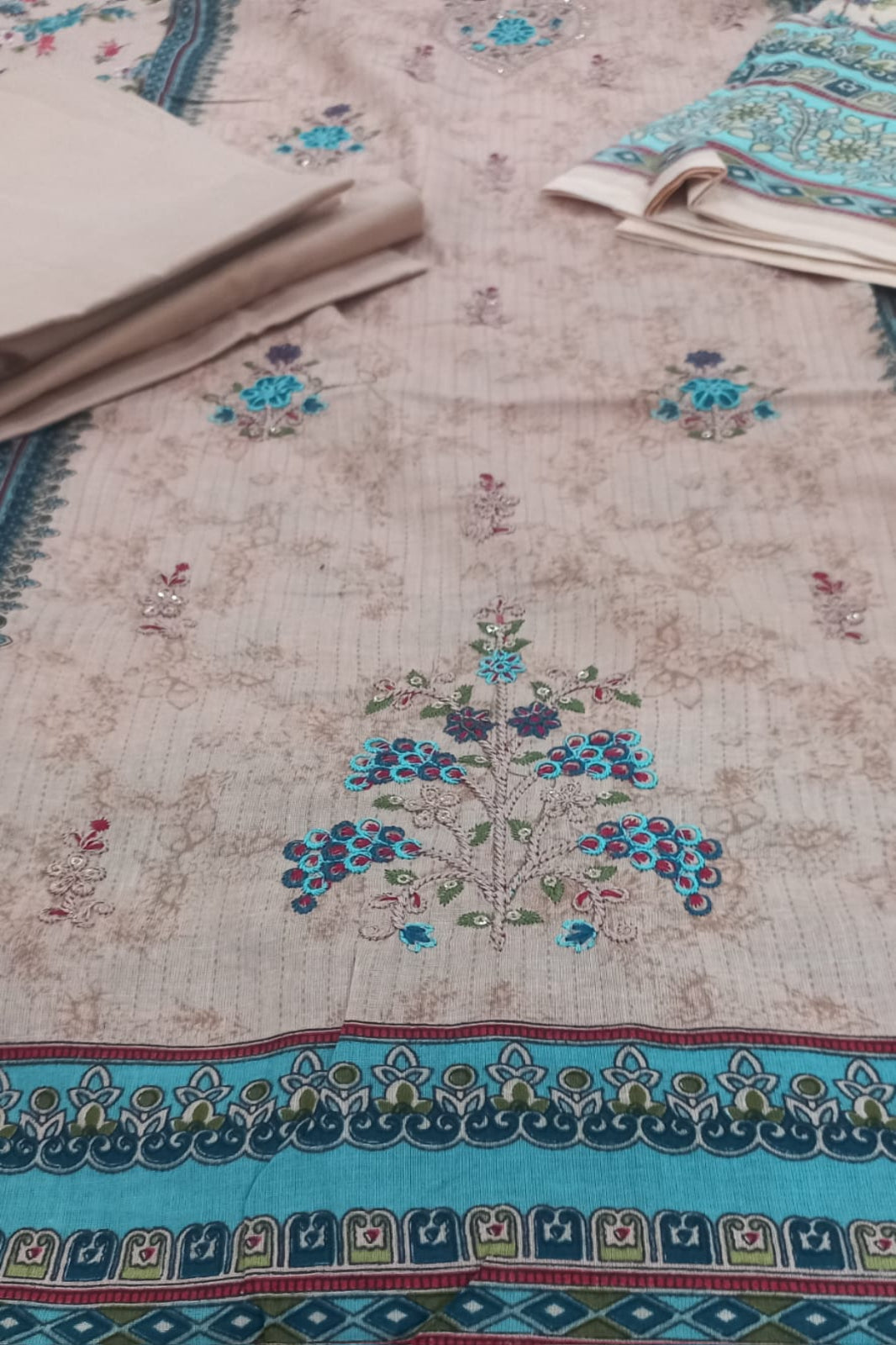 AlZohaib floral patterns and border on a beige background