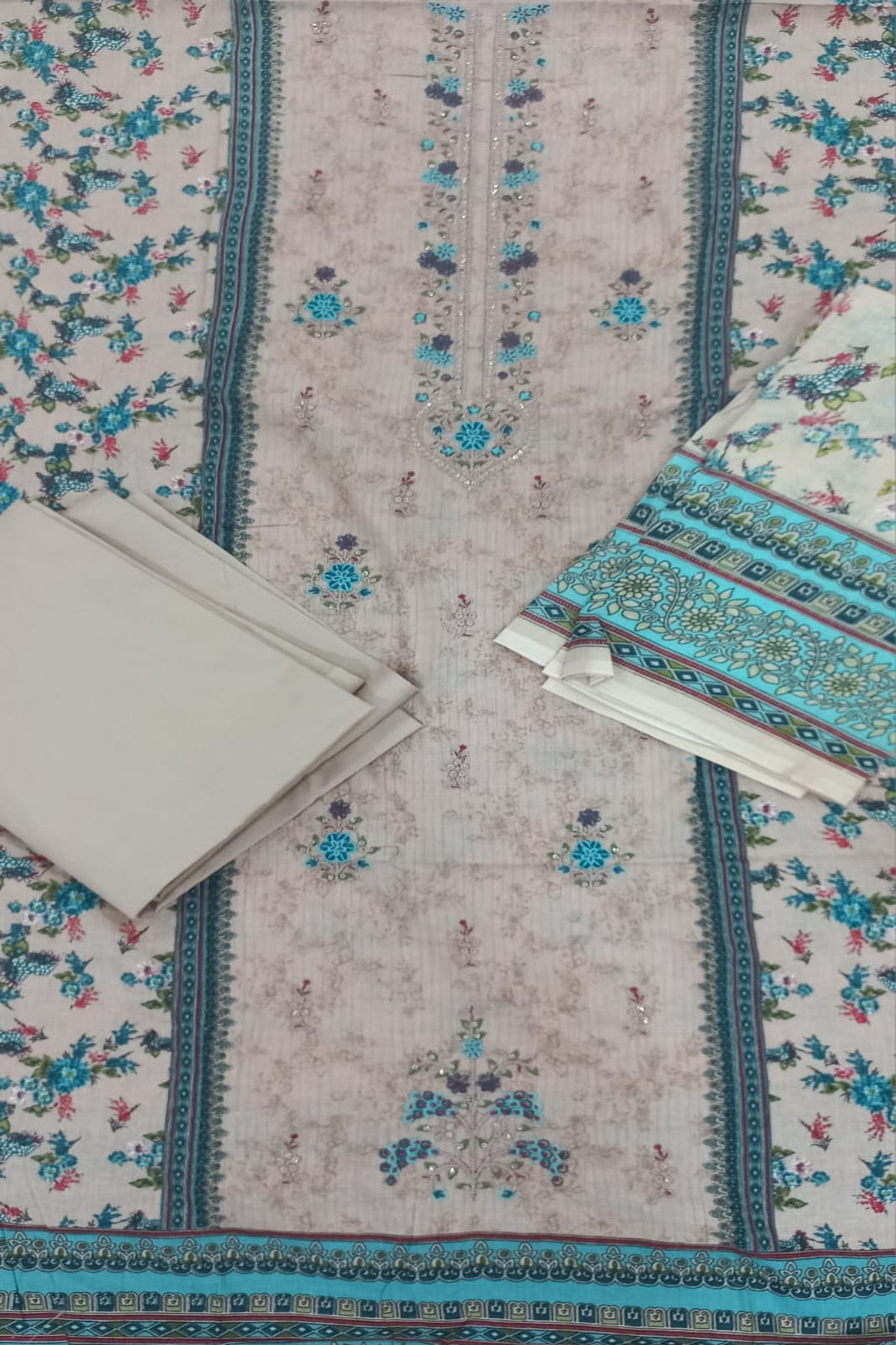  AlZohaib floral patterned fabric with a beige background
