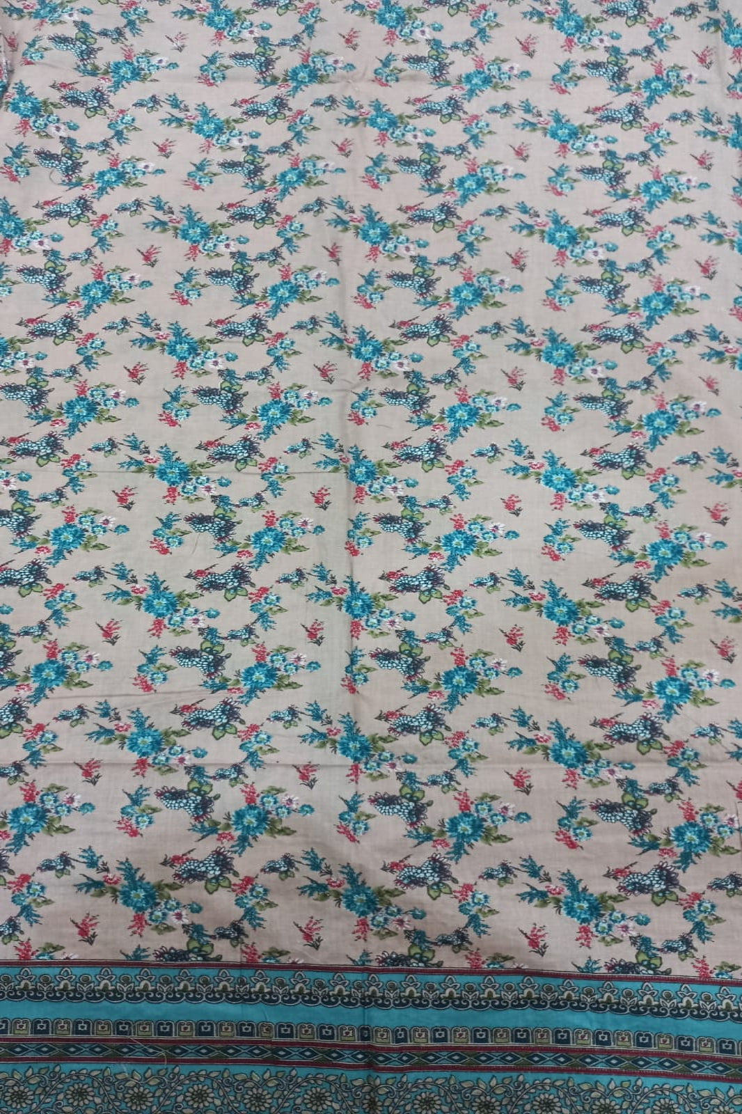 AlZohaib foral patterned fabric with blue and pink flowers on a beige background