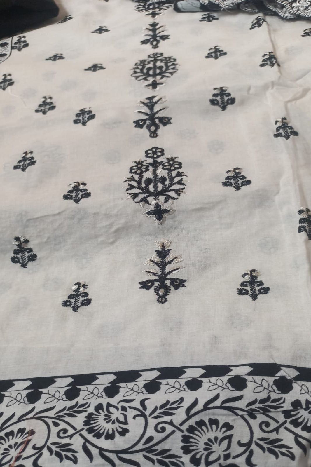 White and black cotton lawn unstitched suit with self-embroidery 
