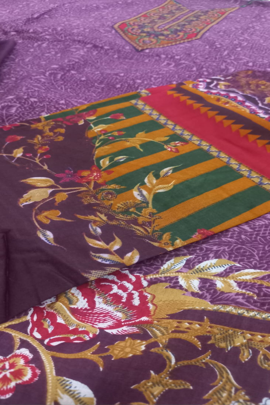 Close-up of a colorful fabric with intricate patterns and designs.