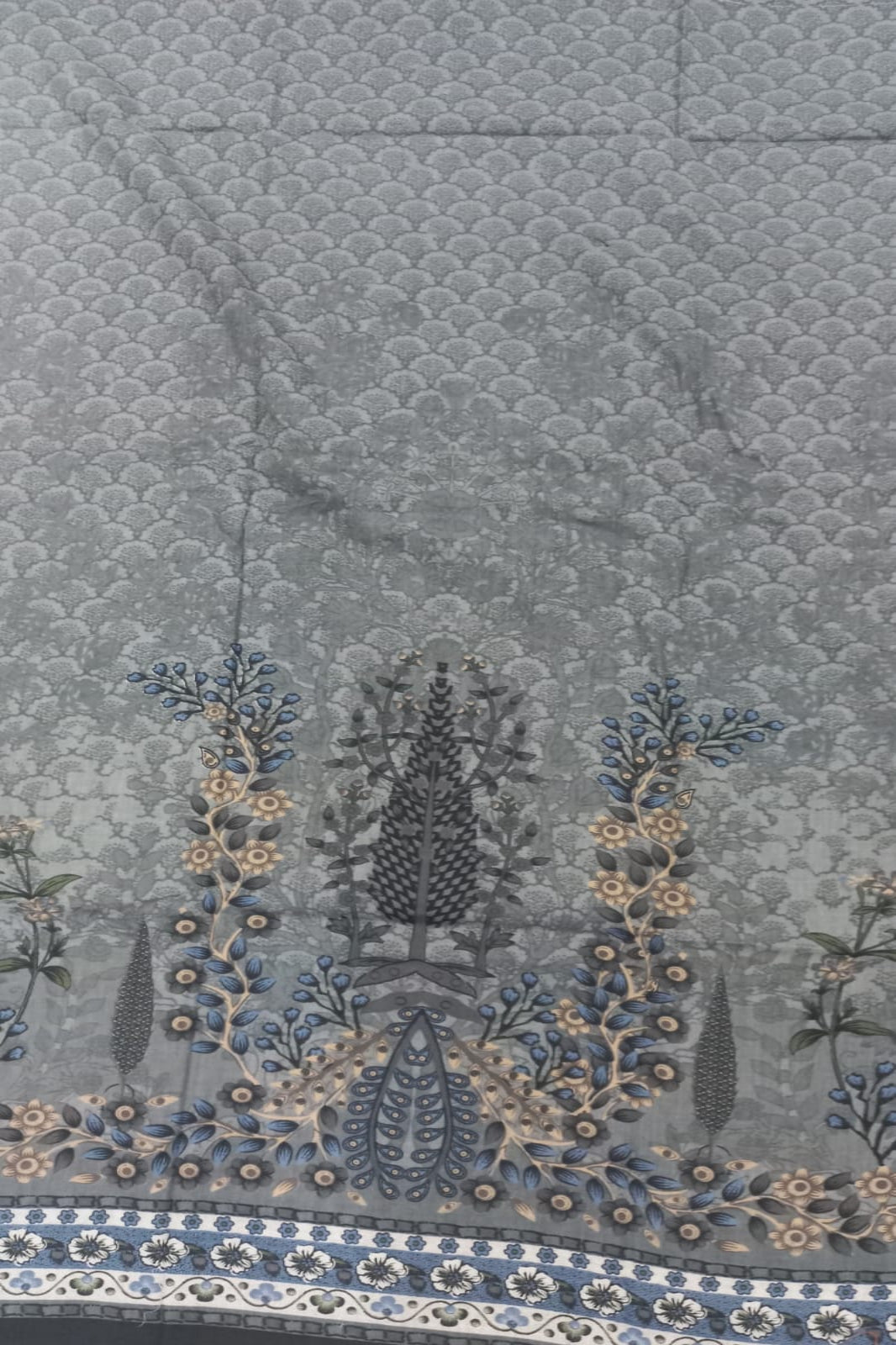 Decorative fabric with floral patterns and embroidery on a textured background